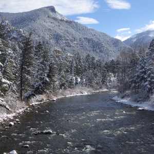 River flowing through snowy mountains.
