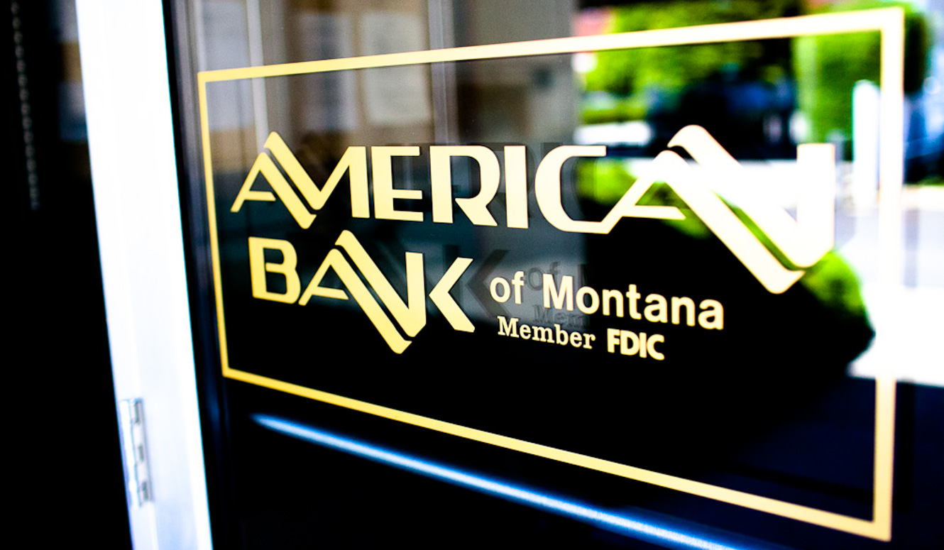 American Bank logo decal on a glass door