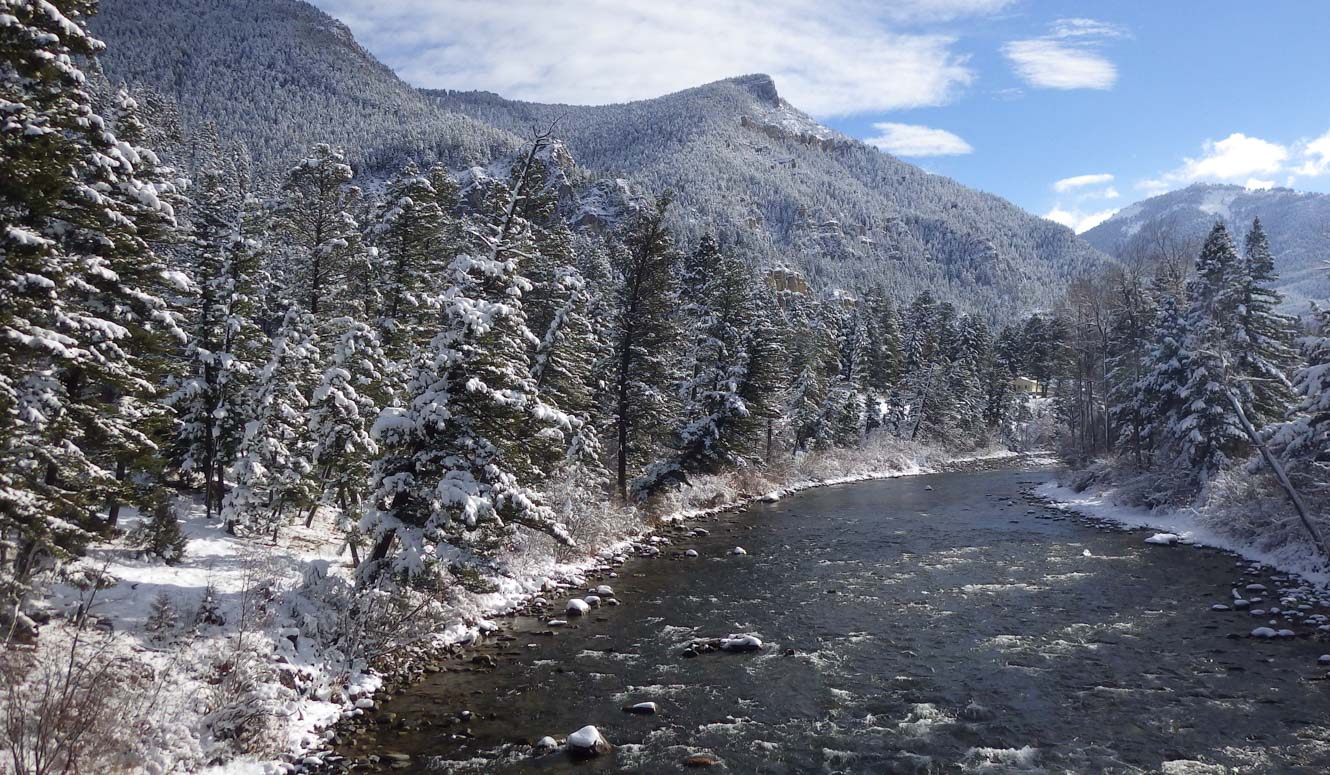 River flowing through snowy mountains.